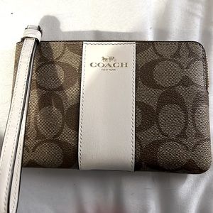 Coach Wristlet -  used once. This is the Corner Zip model very classy looking!